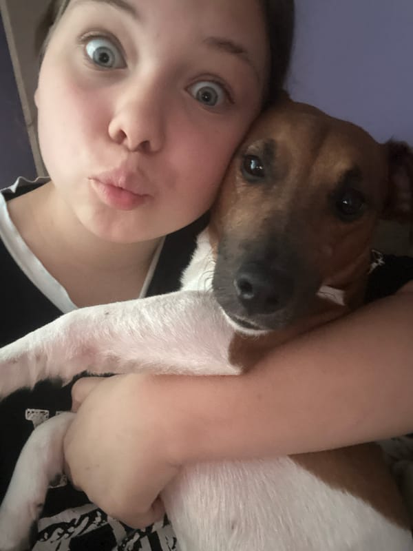 Casual indoor hangout with friends and a dog in Tiraspol