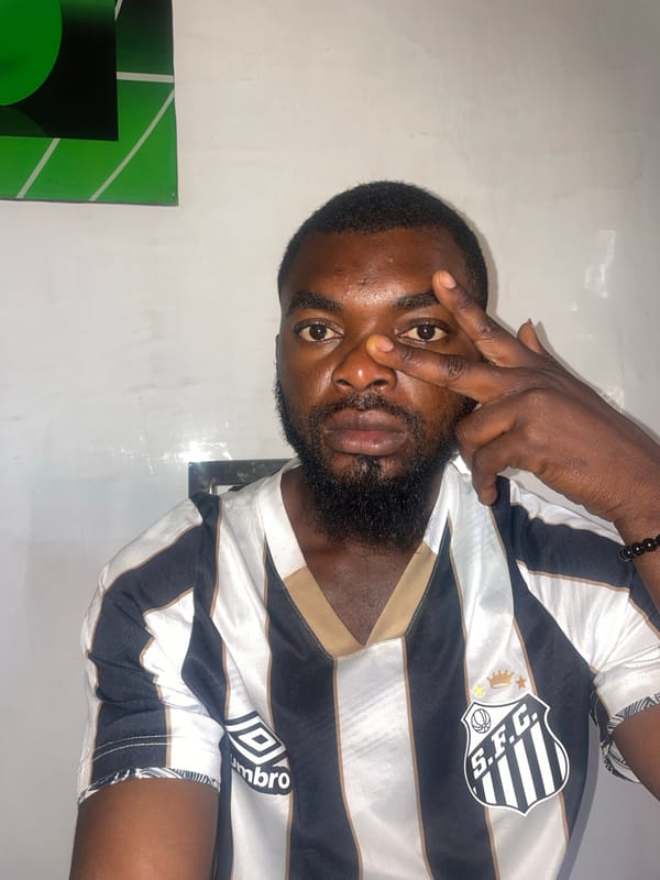 Man in striped jersey enjoys morning drink in Jos