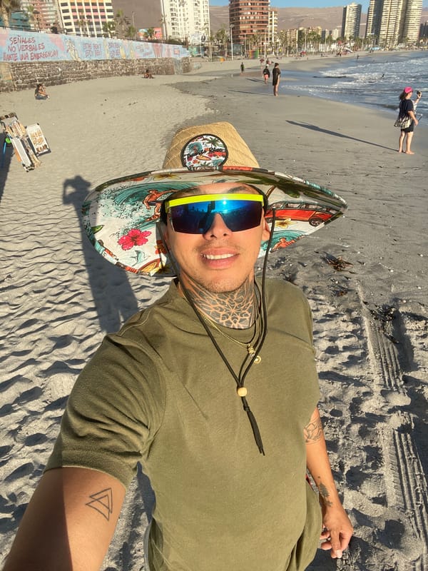 Man rests on Iquique beach in evening hours