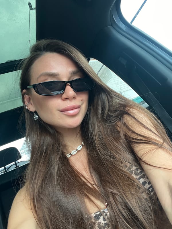 Woman takes car selfies in early morning session