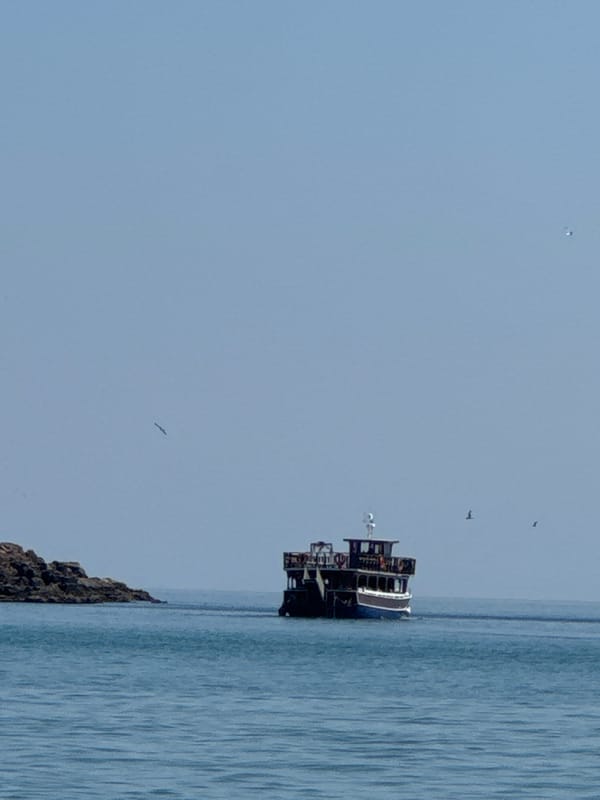 Ferry, paddleboards, and calm Black Sea waters at Sozopol