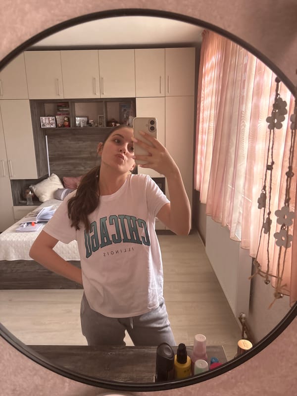 Young woman takes selfies at home in Bulgarovo, Bulgaria