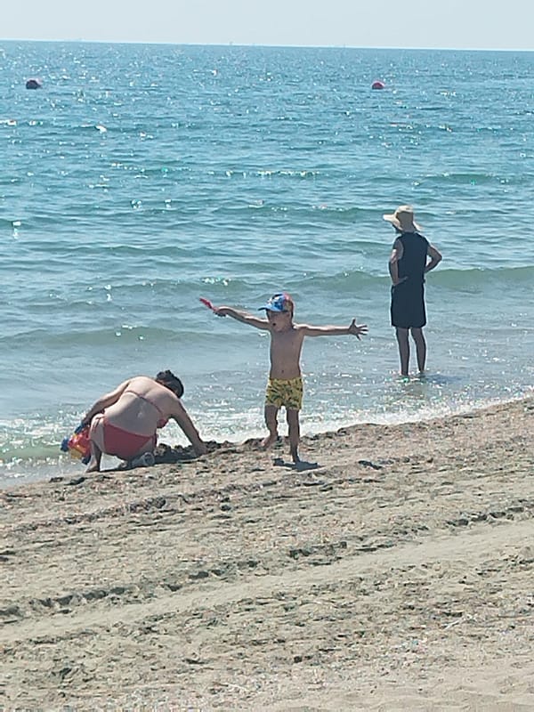 Crowded summer beach day on Romania's Black Sea coast