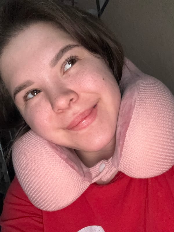 Woman rests with travel pillow in Kazan