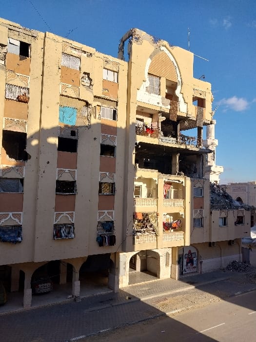 Witness documents damaged buildings, settlements in Khan Yunis