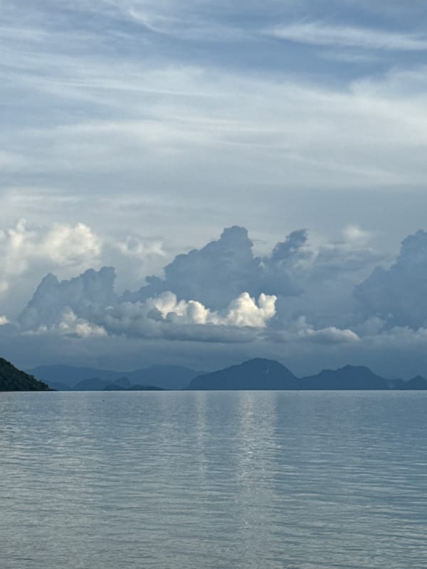 Exploring the rocky shoreline and sea views at Baan Taling Ngam
