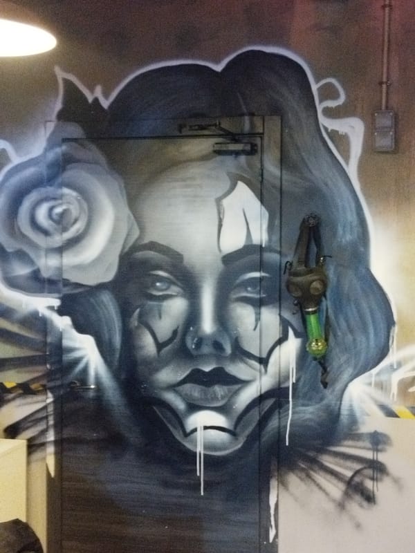 Monochromatic woman's face graffiti documented in Rubí, Spain