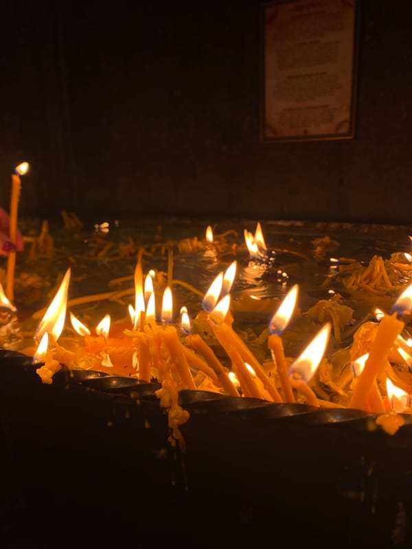 Religious ceremony with candles and floral wreath in Yerevan
