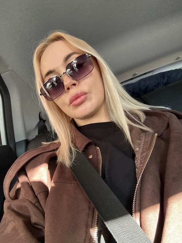 Woman in sunglasses observed in vehicle in Megion