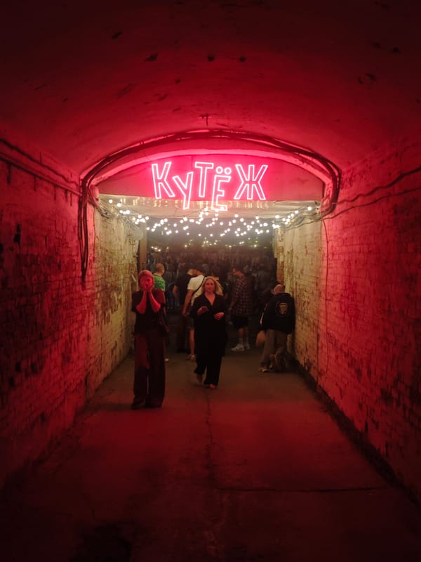 Evening crowds gather in illuminated Samara streets and tunnel