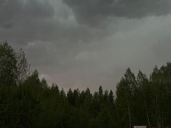 Dark clouds blanket Verkhnii Myrtyiu, Russia during afternoon hours