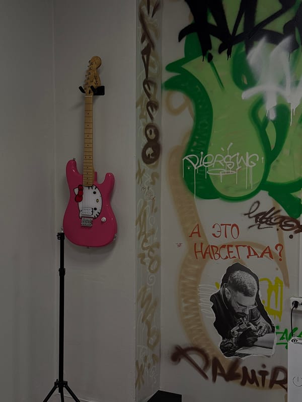 Woman photographs herself in decorated indoor space