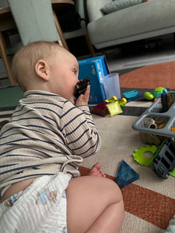 Adult and baby share playtime moment in Fethiye