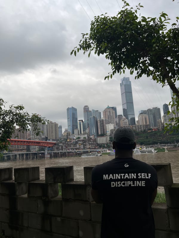 Man poses at Yuzhong District park overlook during morning visit