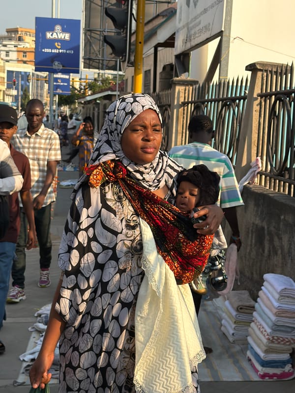 Midday street traffic flows through urban Dar es Salaam