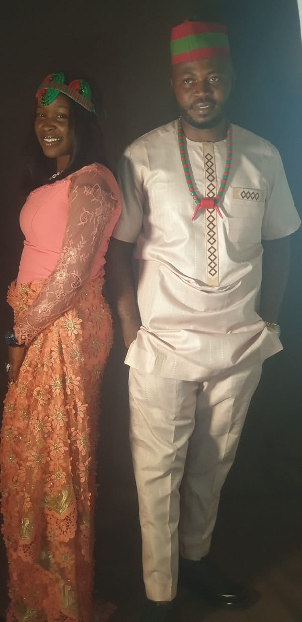 Couple poses for portrait session in Vom studio