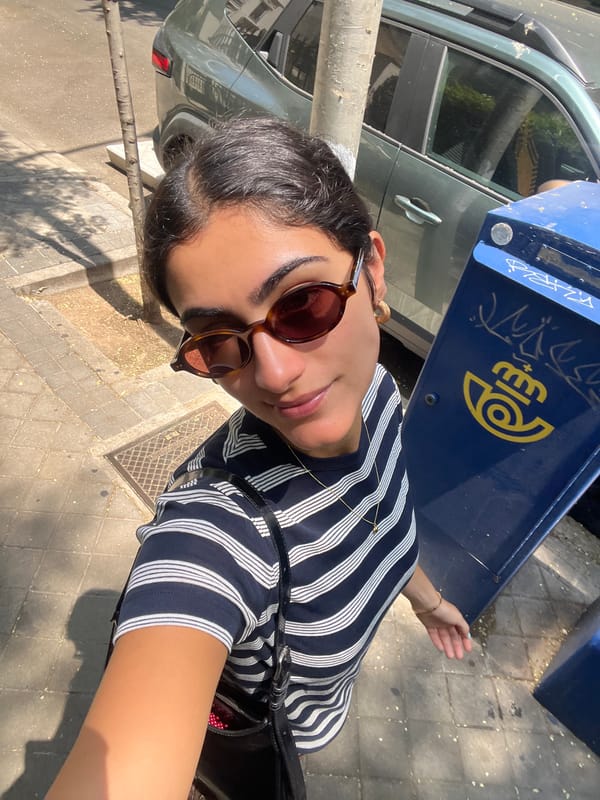 Selfie moment on a Madrid sidewalk, two angles.