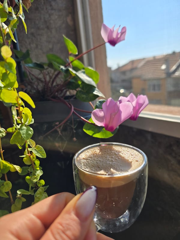 Morning coffee moment captured amid flowers in Burgas, Bulgaria
