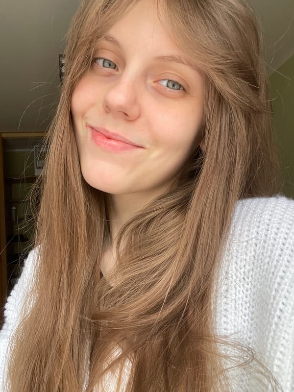 Selfie session in a Ufa apartment, white knit sweater