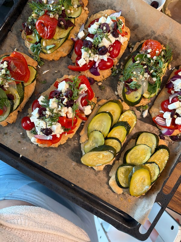 Vegetable flatbreads prepped and ready to bake