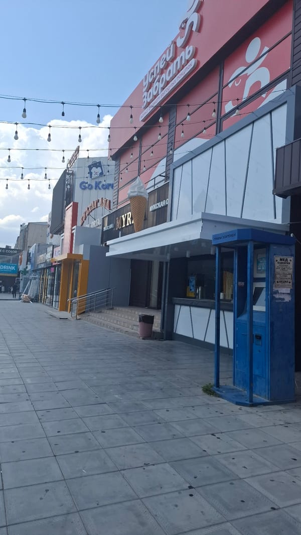 Sunny summer morning drifting through Shymkent streets and shops