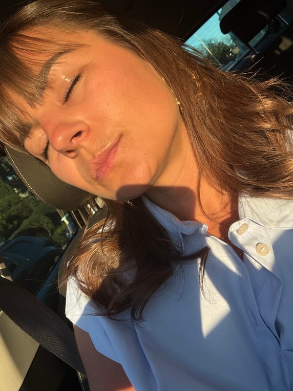 Two women rest in car during Cannes afternoon