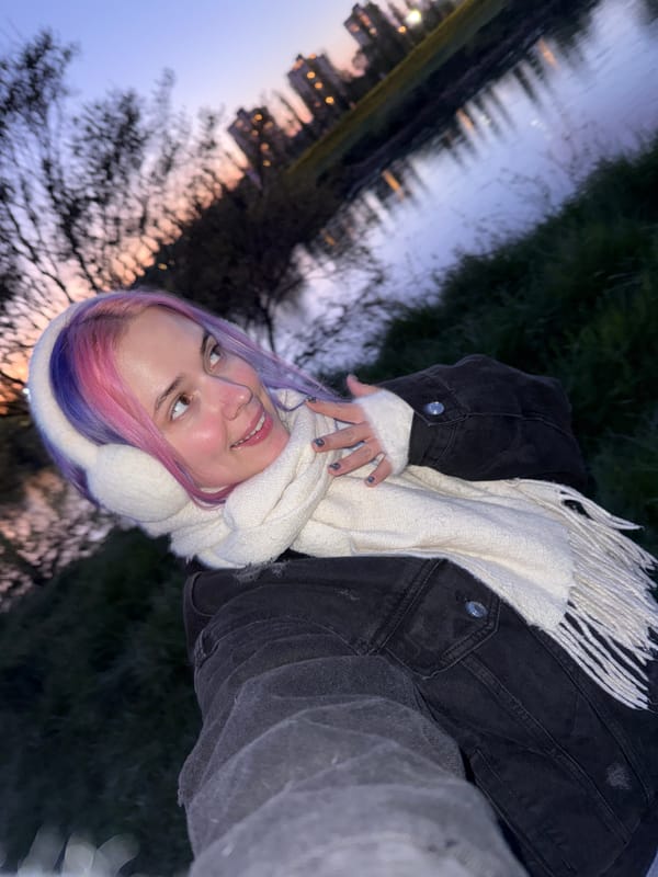 Woman takes evening selfies by water in Zagreb