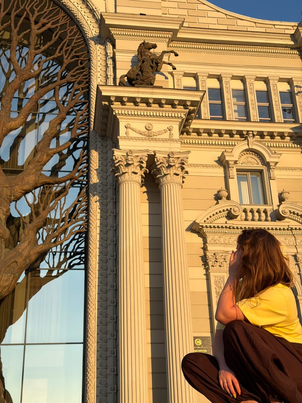 Tourists photograph Kazan landmarks during golden hour visit