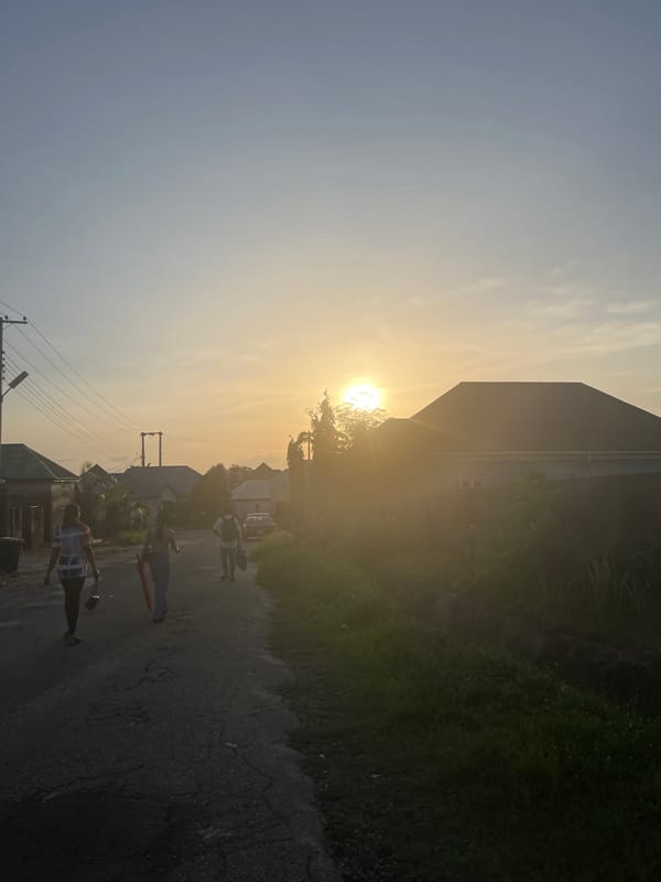 Evening street life captured in Abuja residential neighborhood