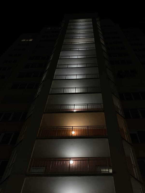 Nighttime tire inflation documented near urban buildings