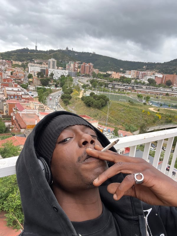 Man in black hoodie documented across Barcelona locations