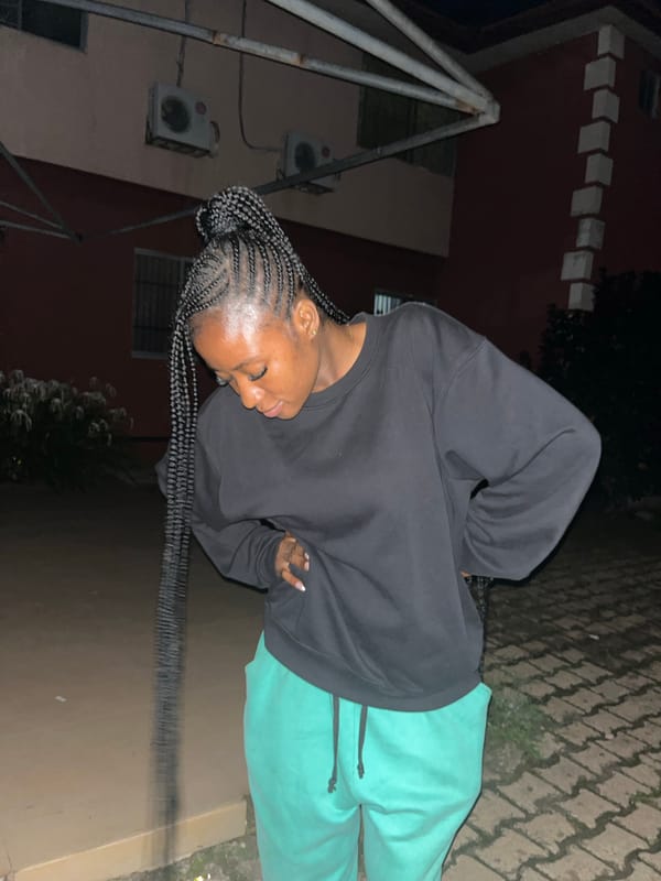 Evening hangout in Jos: soccer, a lounge, and a black Mercedes