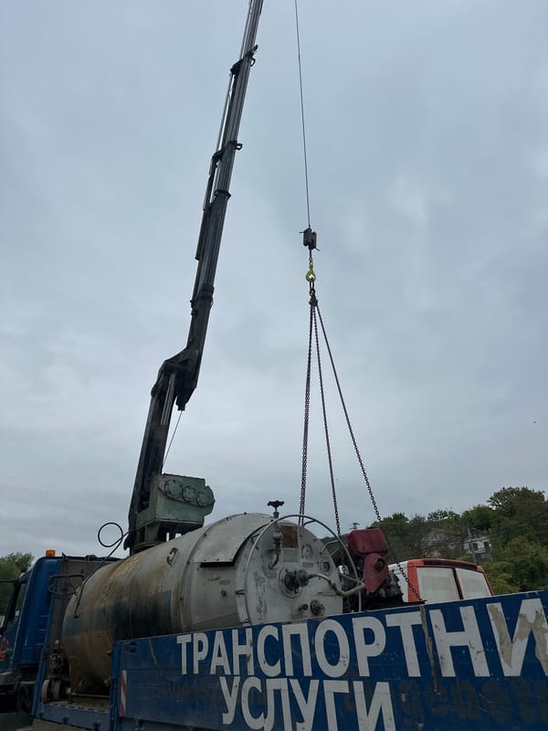 Industrial container loaded onto transport truck in Varna