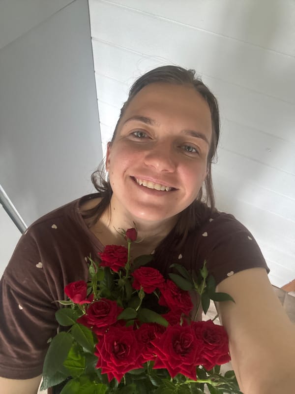Woman with baby and roses captured in domestic moments