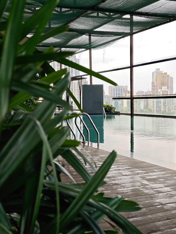 Early morning rooftop pool activity captured in Mumbai