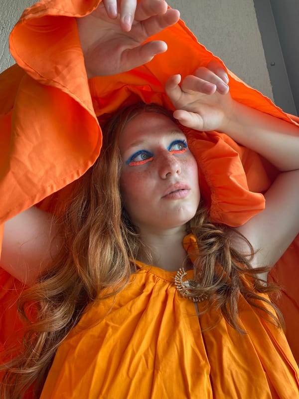 Bold orange fashion shoot on a Sochi balcony