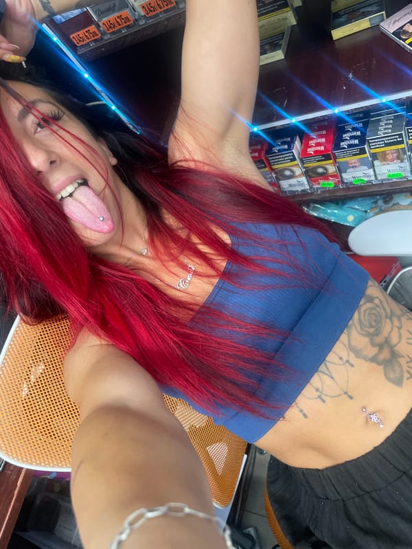 Selfie session in a Sofia shop, tattoos and vape in hand