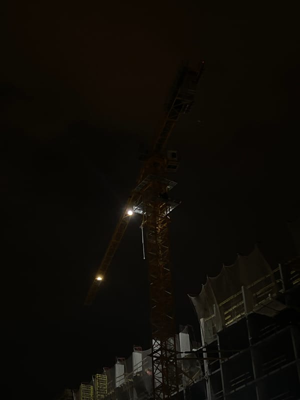Evening construction and urban lighting documented across Astana