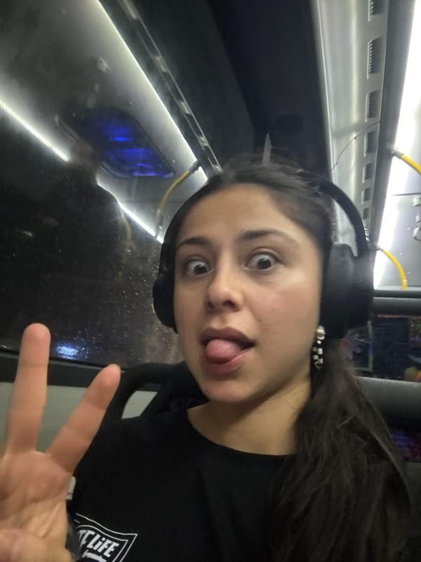 Woman makes playful gestures on public transport in Perth