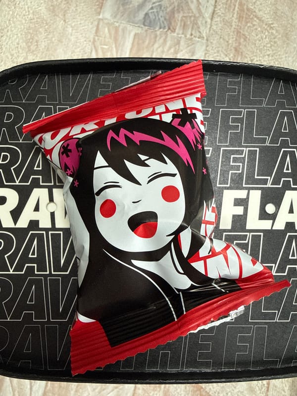 Anime candy wrapper photographed on skateboard deck in London