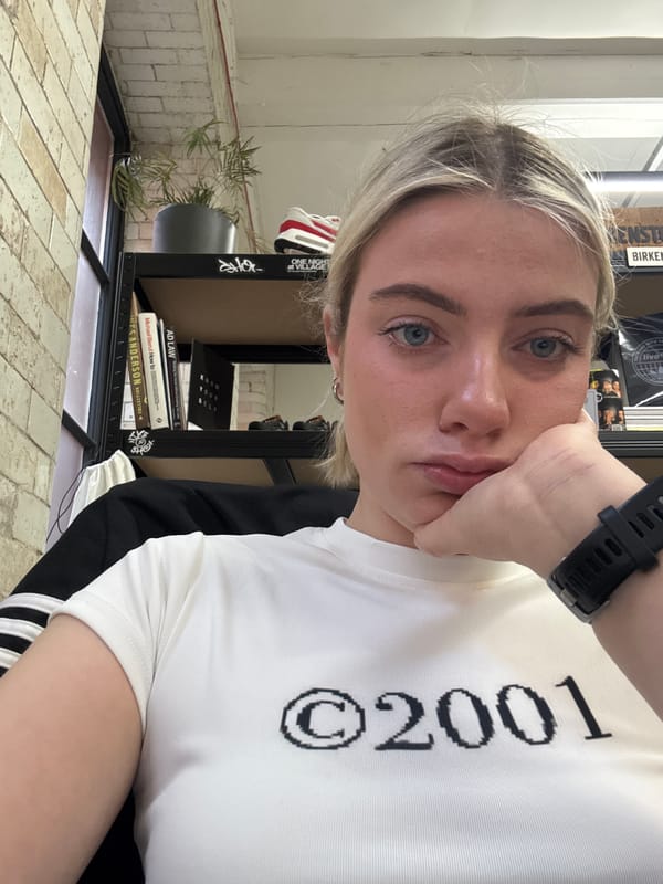 Woman takes selfie in Manchester wearing white shirt