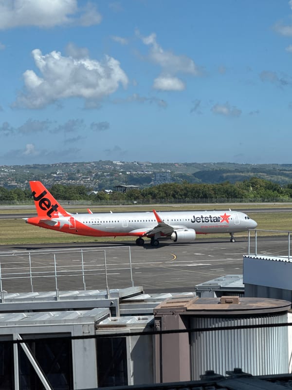 Inside and around Bali's airport on a busy July morning