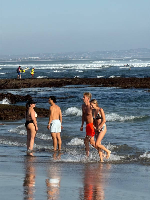 Busy beach morning in North Kuta — surf, sand, and tide pools