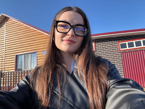 Woman documents sunny afternoon with selfies in Rusalevka