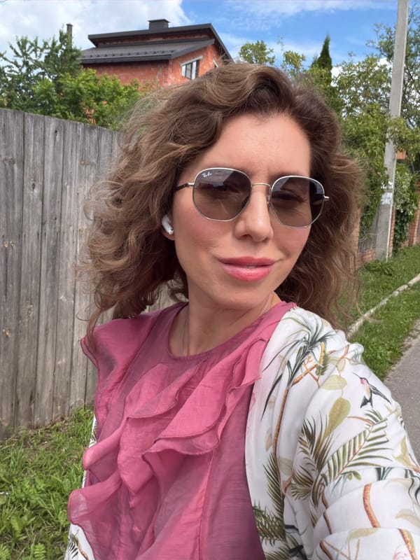 Selfie moment outdoors, tropical jacket and earbuds on