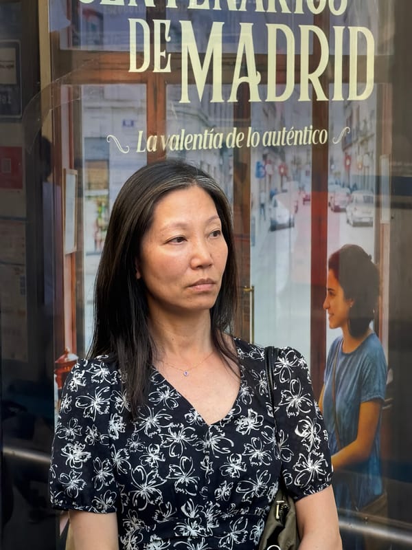 Street-level Madrid: storefronts and foot traffic on a summer evening