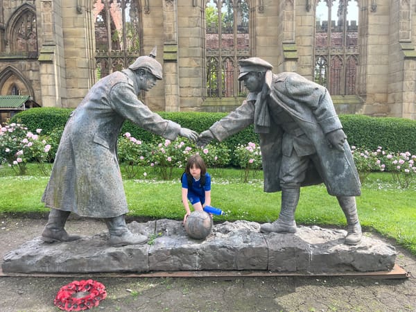 Child visits WWI soldier memorial at Liverpool's St. Luke's ruins
