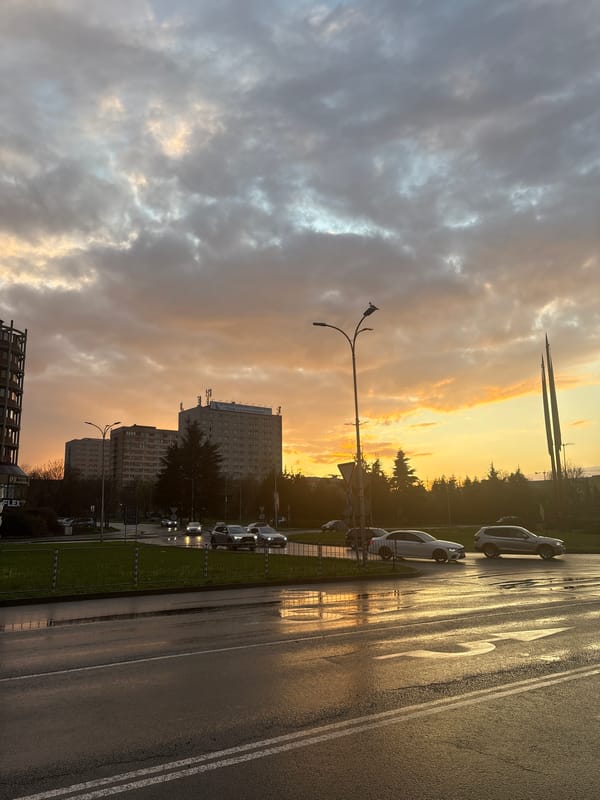 Sunset reflects on wet street in Burgas, Bulgaria