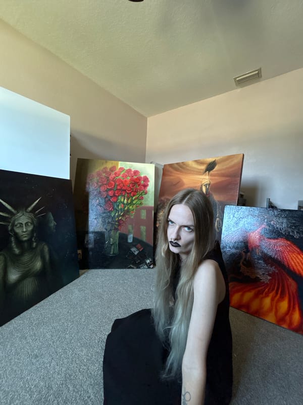 Woman poses with paintings during Cape Coral photo session