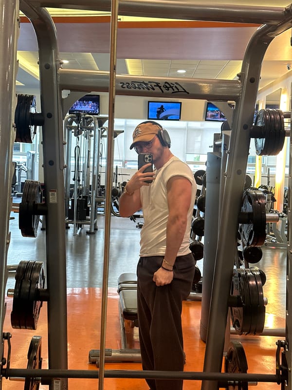 Gym-goer takes smartphone photo during workout session